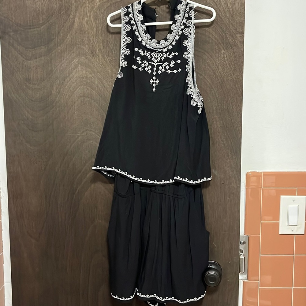 San joy black size small romper. Never worn. Bought in a boutique in California